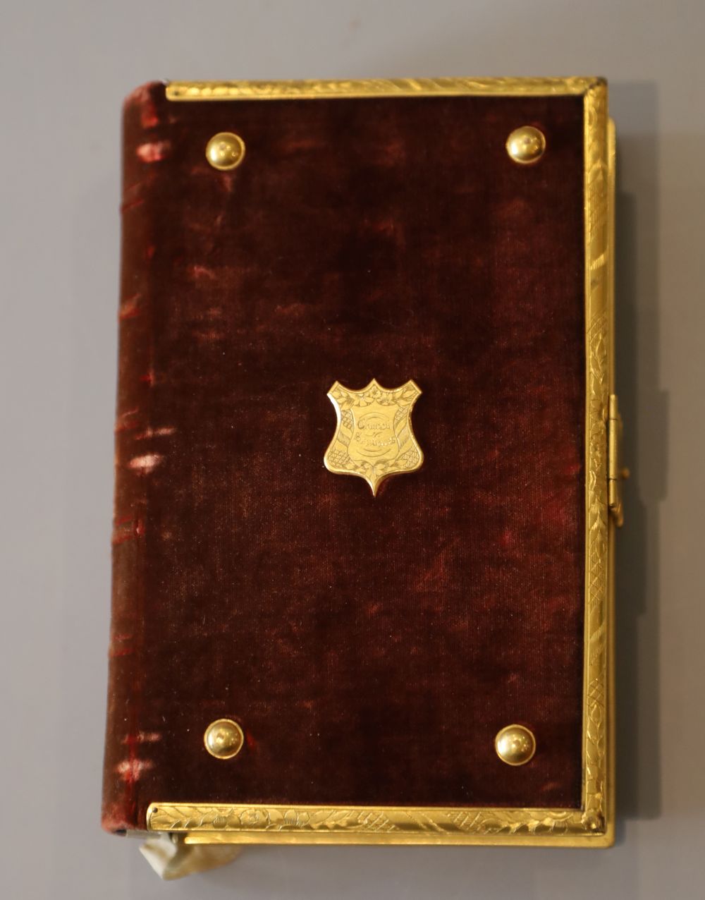 Book of Common Prayer, 12mo, contemporary red velvet, the covers with gilt brass bosses, leaf engraved borders and clasp, inner clasp i